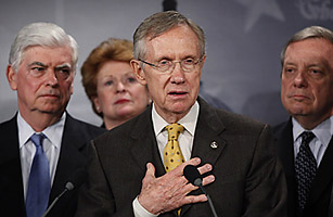 Senate Majority Leader Sen. Harry Reid, D-Nev., second right, with Sens. Chris Dodd, D-Conn., left, Debbie Stabenow, D-Mich., second left, and Dick Durbin, D-Ill., right, speaks to the media about the Democratic health care bill on Capitol Hill, Wednesday, Nov. 18, 2009, in Washington.